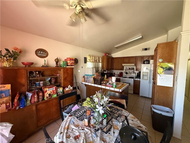 5320 Jonah St, Bakersfield, CA 93307 - dining room with light tile patterned floors, ceiling fan, and lofted ceiling