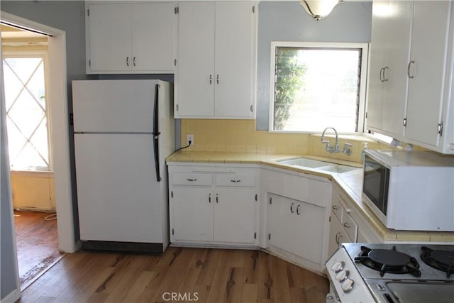 841 N Naomi St, Burbank, CA 91505 - kitchen with white appliances, light wood-style floors, white cabinetry, and healthy amount of natural light