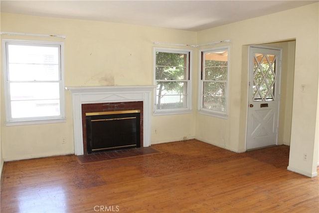 841 N Naomi St, Burbank, CA 91505 - unfurnished living room with wood finished floors and a brick fireplace