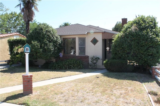 841 N Naomi St, Burbank, CA 91505 - view of front of house featuring stucco siding and a front yard