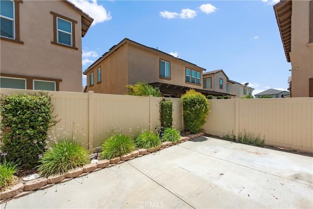 16123 Apricot Ave, Chino, CA 91708 - fenced backyard with a patio area