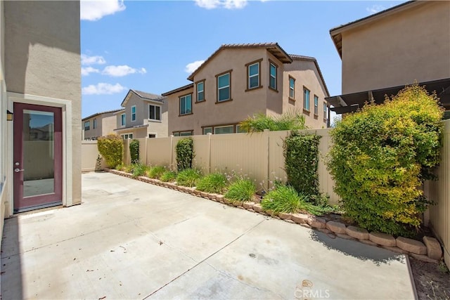 16123 Apricot Ave, Chino, CA 91708 - fenced backyard featuring a patio area and a residential view