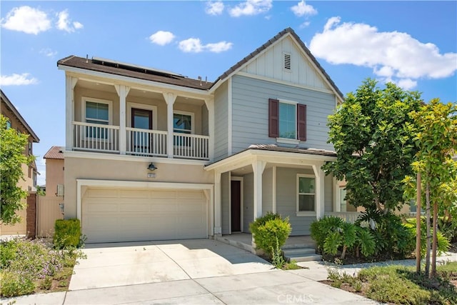 16123 Apricot Ave, Chino, CA 91708 - craftsman-style house with a porch, board and batten siding, driveway, an attached garage, and roof mounted solar panels