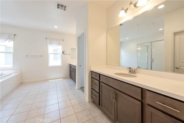 16123 Apricot Ave, Chino, CA 91708 - bathroom featuring vanity, a shower stall, tile patterned floors, a bath, and recessed lighting