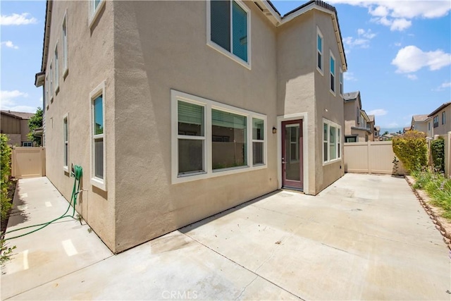 16123 Apricot Ave, Chino, CA 91708 - back of property with stucco siding, a patio area, and a fenced backyard