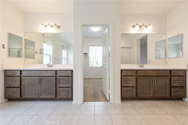 16123 Apricot Ave, Chino, CA 91708 - bathroom featuring two vanities and tile patterned flooring