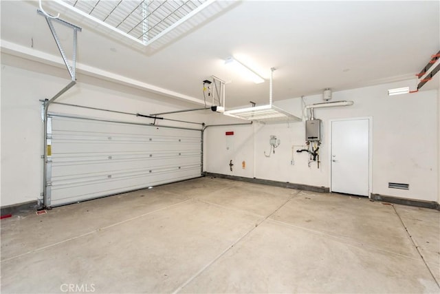 16123 Apricot Ave, Chino, CA 91708 - garage with water heater and baseboards