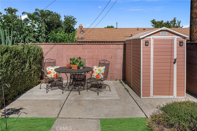 9811 Kempster Ave, Fontana, CA 92335 - view of patio / terrace featuring a shed and outdoor dining area