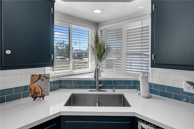 9811 Kempster Ave, Fontana, CA 92335 - kitchen with backsplash, light countertops, and dishwasher