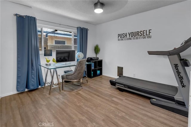 9811 Kempster Ave, Fontana, CA 92335 - home office with wood finished floors and a textured ceiling