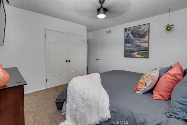 9811 Kempster Ave, Fontana, CA 92335 - carpeted bedroom with a textured ceiling, a ceiling fan, and a closet