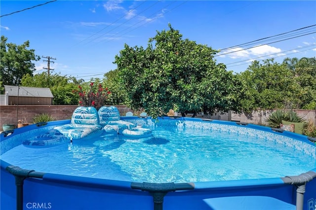 9811 Kempster Ave, Fontana, CA 92335 - view of swimming pool with a fenced backyard