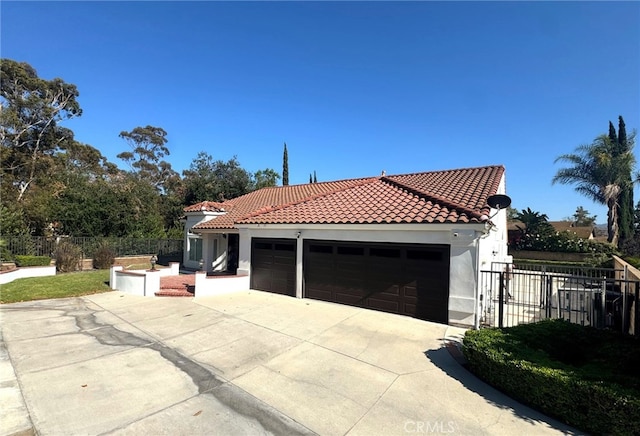 5560 Feather Grass Ln, Yorba Linda, CA 92887 - view of property exterior with a tiled roof, a garage, concrete driveway, and stucco siding
