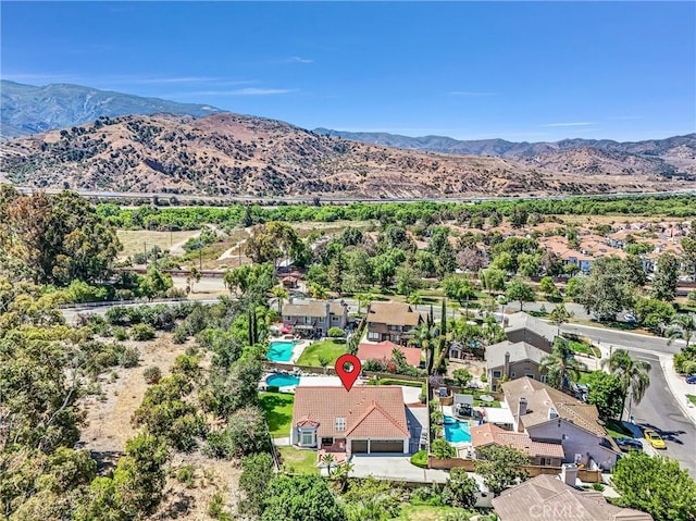 5560 Feather Grass Ln, Yorba Linda, CA 92887 - aerial perspective of suburban area with mountains and a pool area