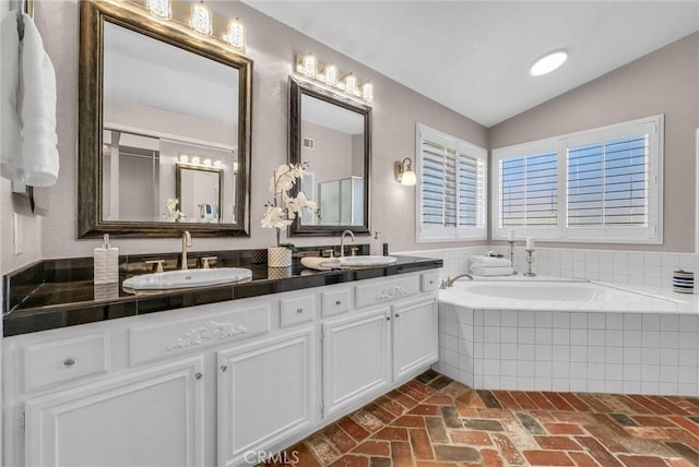 5560 Feather Grass Ln, Yorba Linda, CA 92887 - full bath featuring double vanity, a bath, lofted ceiling, and brick floors