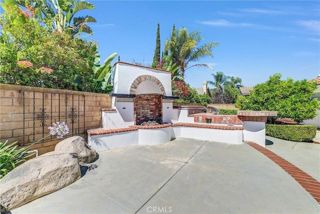5560 Feather Grass Ln, Yorba Linda, CA 92887 - view of patio featuring an outdoor brick fireplace