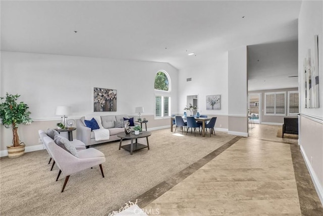 5560 Feather Grass Ln, Yorba Linda, CA 92887 - living area featuring lofted ceiling and baseboards