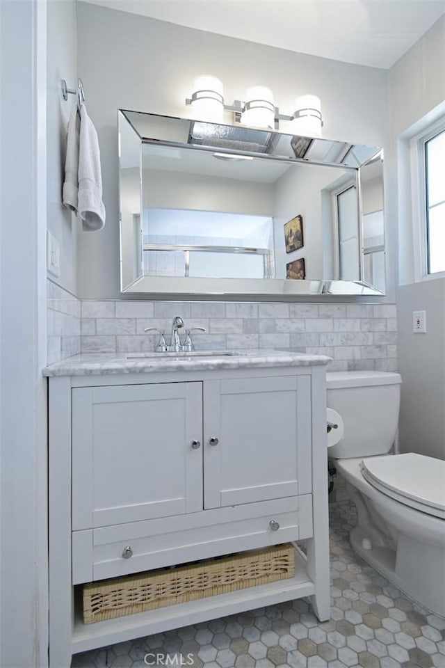 4140 Warner Blvd Unit 302, Burbank, CA 91505 - bathroom with vanity, tile walls, and tile patterned floors
