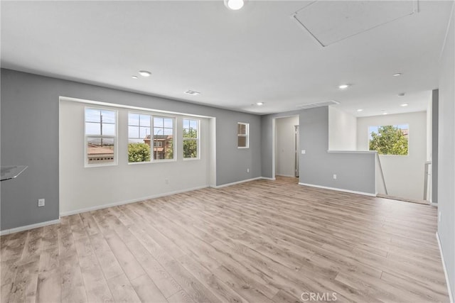 26627 Pearl Blossom Way, Menifee, CA 92585 - unfurnished living room featuring light wood-style floors and recessed lighting