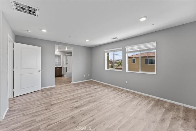 26627 Pearl Blossom Way, Menifee, CA 92585 - unfurnished bedroom featuring light wood finished floors, recessed lighting, and ensuite bath