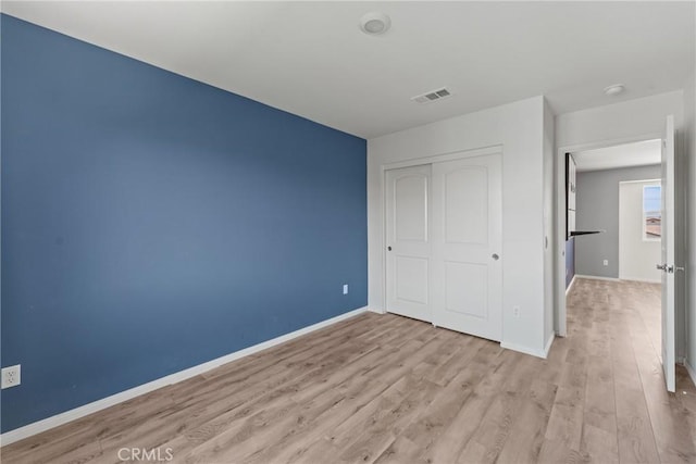 26627 Pearl Blossom Way, Menifee, CA 92585 - unfurnished bedroom featuring light wood-type flooring and a closet