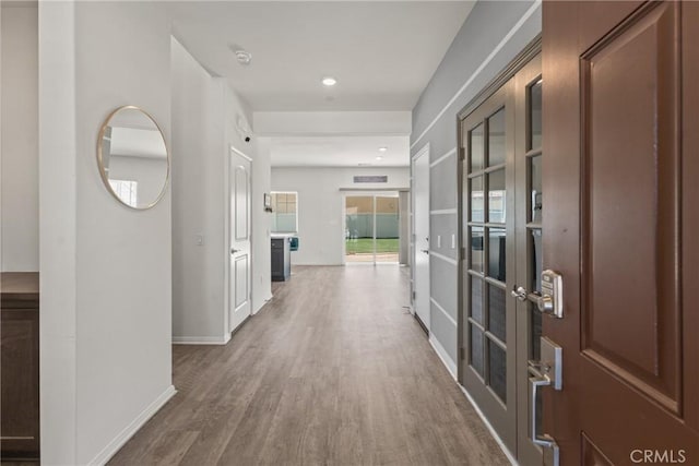 26627 Pearl Blossom Way, Menifee, CA 92585 - hall with wood finished floors, french doors, and recessed lighting