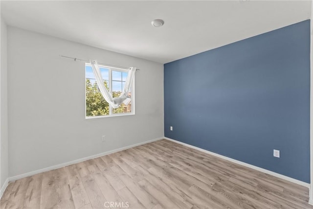 26627 Pearl Blossom Way, Menifee, CA 92585 - empty room with wood finished floors and baseboards