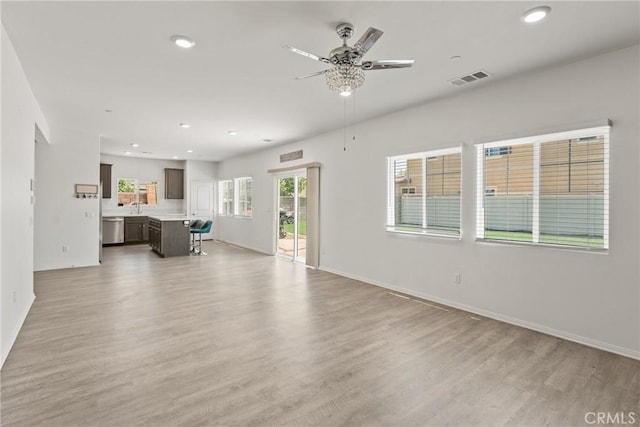 26627 Pearl Blossom Way, Menifee, CA 92585 - unfurnished living room with ceiling fan, light wood-style floors, and recessed lighting