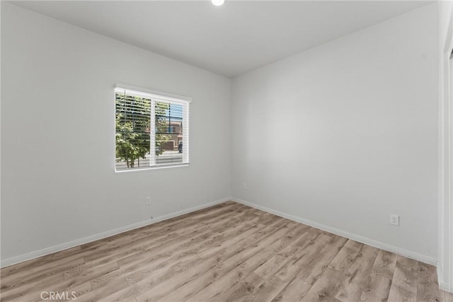 26627 Pearl Blossom Way, Menifee, CA 92585 - empty room featuring light wood-style flooring and baseboards