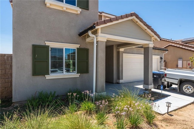 26627 Pearl Blossom Way, Menifee, CA 92585 - view of front of property featuring an attached garage, stucco siding, and driveway
