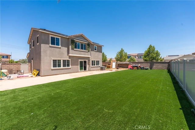 26627 Pearl Blossom Way, Menifee, CA 92585 - back of house with a fenced backyard, a patio area, and stucco siding