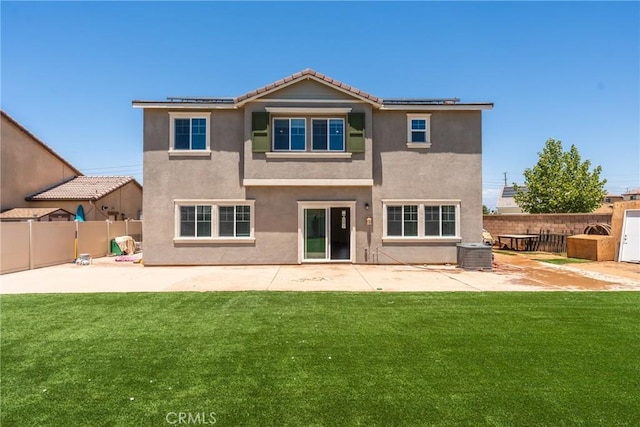 26627 Pearl Blossom Way, Menifee, CA 92585 - rear view of house with solar panels, a patio, stucco siding, and a fenced backyard