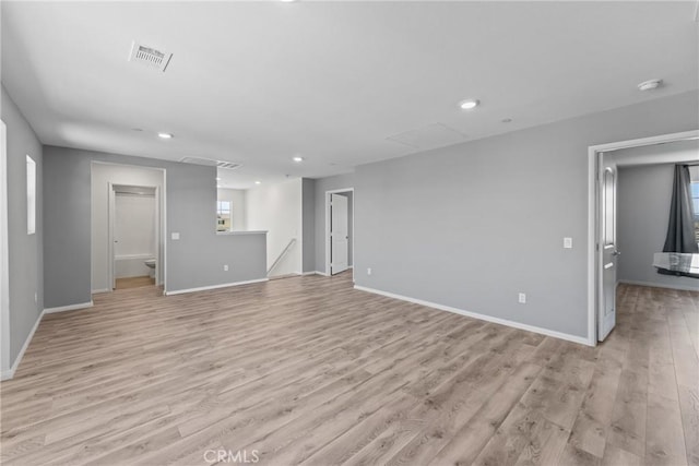 26627 Pearl Blossom Way, Menifee, CA 92585 - unfurnished living room with attic access, light wood-style flooring, and recessed lighting