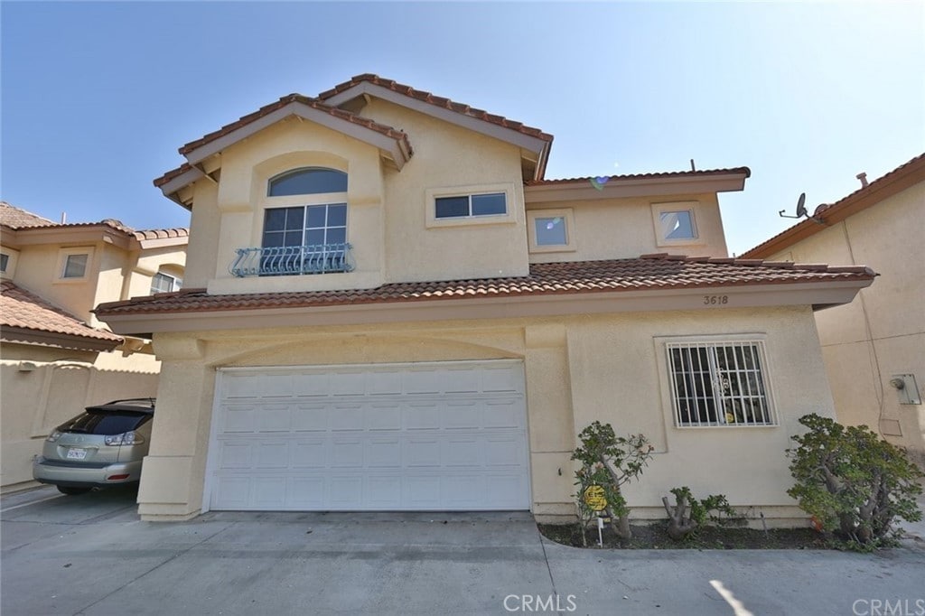 3618 Durfee Ave, El Monte, CA 91732 - view of front of house with an attached garage, driveway, and stucco siding