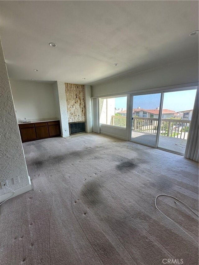 15 Hilltop Cir, Rancho Palos Verdes, CA 90275 - unfurnished living room featuring carpet, a fireplace, and recessed lighting