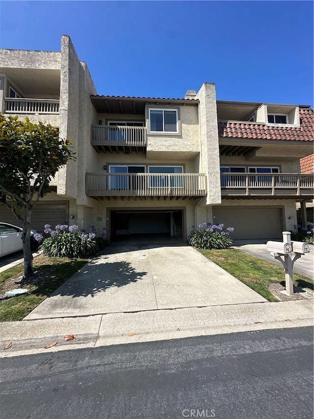 15 Hilltop Cir, Rancho Palos Verdes, CA 90275 - view of property with an attached garage and concrete driveway