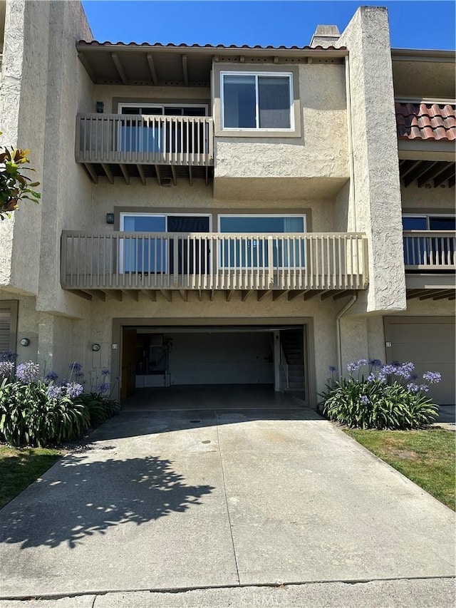 15 Hilltop Cir, Rancho Palos Verdes, CA 90275 - view of building exterior with a garage and concrete driveway
