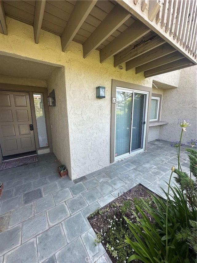 15 Hilltop Cir, Rancho Palos Verdes, CA 90275 - property entrance featuring stucco siding and a patio area