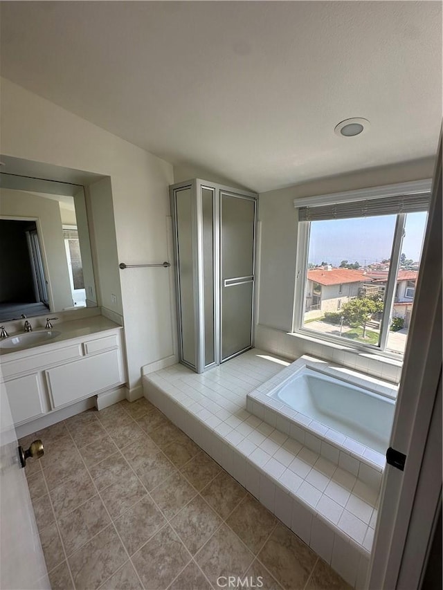 15 Hilltop Cir, Rancho Palos Verdes, CA 90275 - bathroom with vanity, a shower stall, a garden tub, and tile patterned floors