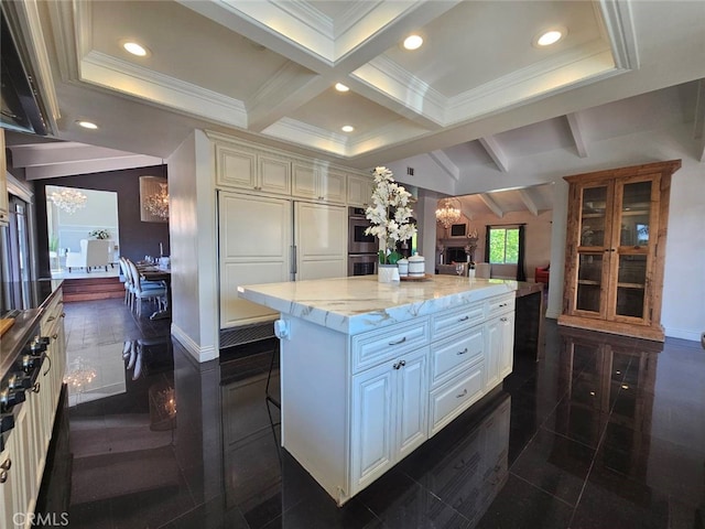 940 N Silent Ranch Dr, Glendora, CA 91741 - kitchen featuring beam ceiling, a center island, light stone counters, stainless steel double oven, and a chandelier