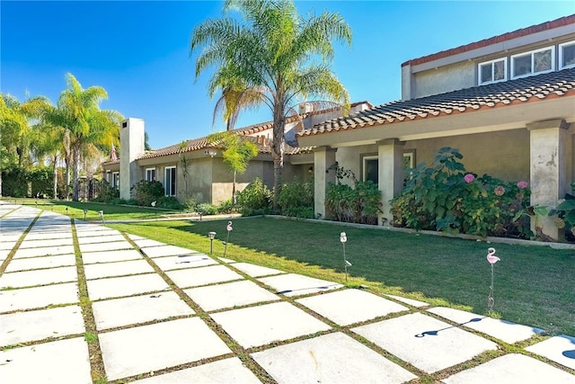 940 N Silent Ranch Dr, Glendora, CA 91741 - view of front facade featuring stucco siding, a tiled roof, and a front yard
