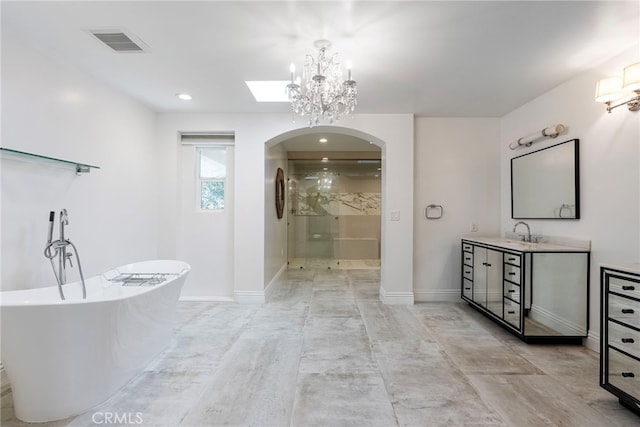 940 N Silent Ranch Dr, Glendora, CA 91741 - bathroom with vanity, a soaking tub, a stall shower, a chandelier, and recessed lighting