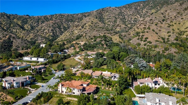 940 N Silent Ranch Dr, Glendora, CA 91741 - aerial overview of property's location with nearby suburban area and a mountainous background