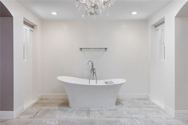 940 N Silent Ranch Dr, Glendora, CA 91741 - bathroom featuring a soaking tub, a chandelier, and recessed lighting