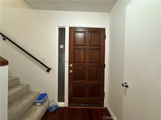 1024 S Marengo Ave Unit 6, Alhambra, CA 91803 - entrance foyer with dark wood-style flooring, stairway, and a textured ceiling