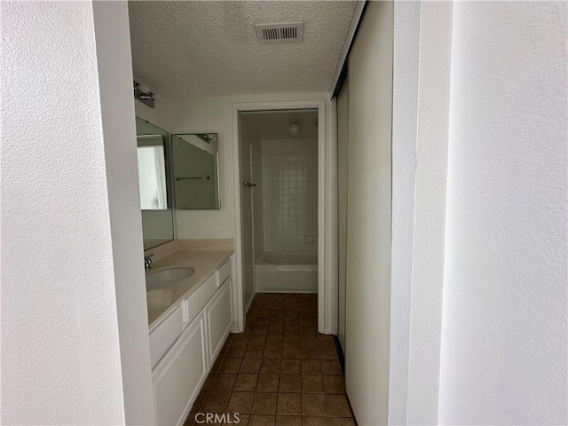 1024 S Marengo Ave Unit 6, Alhambra, CA 91803 - bathroom featuring a textured ceiling, vanity, and tile patterned flooring