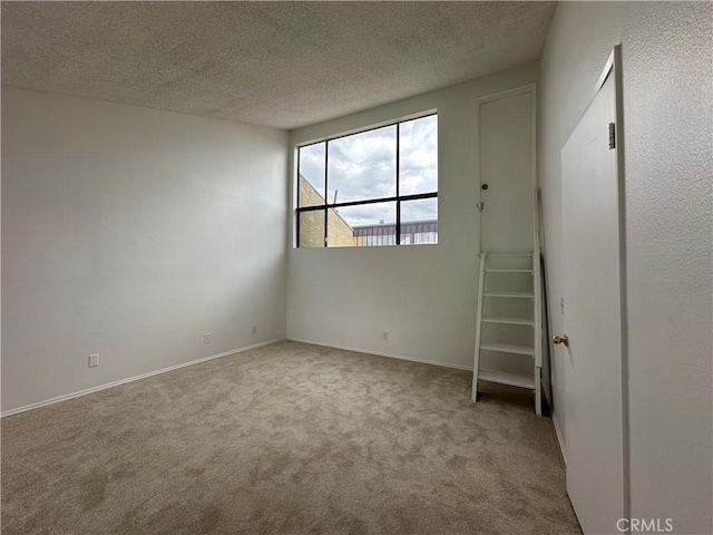 1024 S Marengo Ave Unit 6, Alhambra, CA 91803 - unfurnished bedroom featuring carpet and a textured ceiling