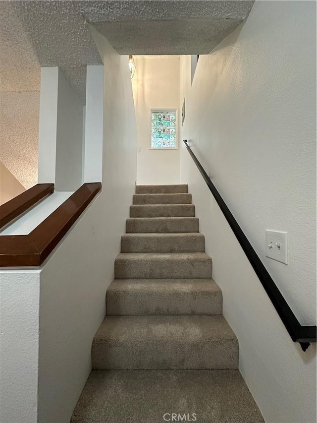 1024 S Marengo Ave Unit 6, Alhambra, CA 91803 - staircase featuring carpet flooring