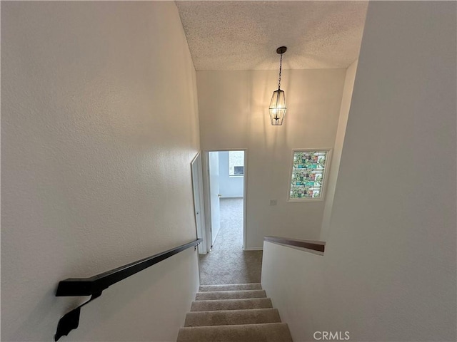 1024 S Marengo Ave Unit 6, Alhambra, CA 91803 - stairway with a textured ceiling and carpet floors