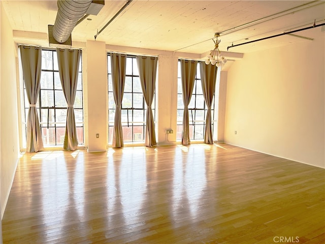200 N San Fernando Rd Unit 313, Los Angeles, CA 90031 - empty room featuring plenty of natural light, wood finished floors, and a chandelier